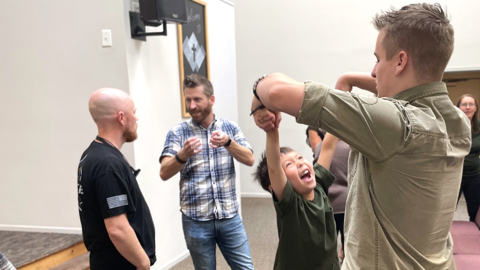 Church members laughing together after a Sunday service